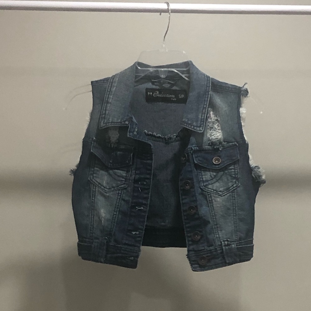 Distressed denim vest